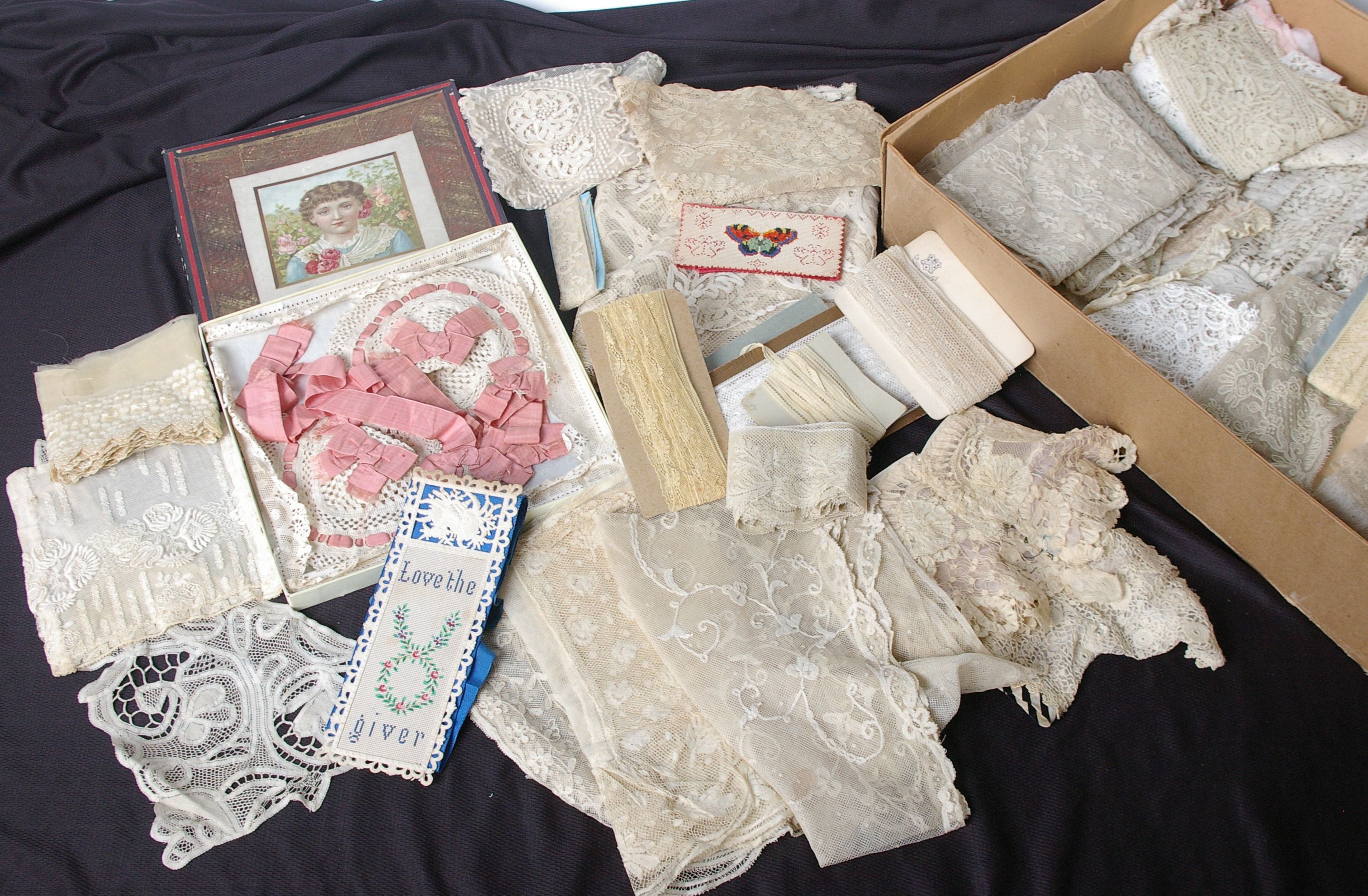 Two boxes of late 19th and early 20th Century black and cream lace and accessories, including a