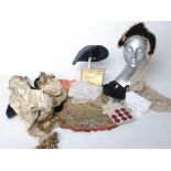 A quantity of assorted accessories to include hats, buttons, buckles, a gold coloured vanity box