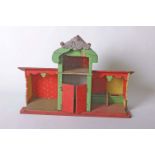 A late 19th Century German green and red painted wooden toy stable, width 74 cms, height 51 cms