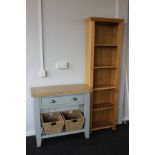 A tall light oak bookcase (h: 180cm w: 55cm d: 25cm) and a painted wooden basket console table (h: