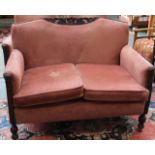 An Edwardian upholstered show wood three piece suite. Two seater sofa and two armchairs in dark pink