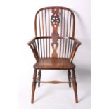 A 19th Century ash, elm and beech wheel back windsor armchair