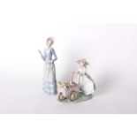 A Lladro figure 'Kitty Cart', a figure pushing a cart with flowers and cats, no. 6141 together