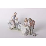 A Lladro figural group 'Courting Time' a lady taking a gentlemans hand, no 5409, and a Lladro