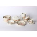 A Poole Pottery dinner service including bowls, plates, cups saucers and casserole dishes