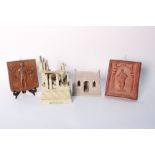 A Gothic model building and a sandstone structure, together with three pottery wall plaques (5)