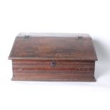 An 18th Century oak bible box with sloping fall, bearing date to the front 1703 31cm high, 69cm