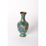 A Chinese cloisonne vase of baluster form, depicting yellow dragons on a turquoise ground 21cm high