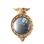 A Regency style gilt convex mirror with eagle cresting 72cm high and a full length mirror