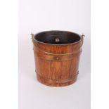 An R A Lister & Co brass bound oak coal bucket with swing handle and tin liner, 43cm h, ivorine