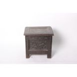 A small carved oak coffer 53cm high, 54cm wide