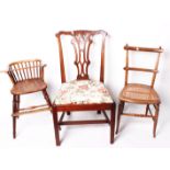 A provincial childs high chair, a pair of cane chairs and a Victorian upholstered chair and an