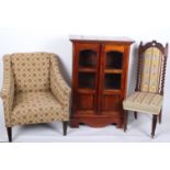 A Victorian needlework chair, upholstered tub chair and a panelled cupboard in hardwood.