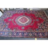 A Middle Eastern rug 330 x 230cm