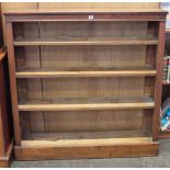 An oak open bookcase and tile back washstand