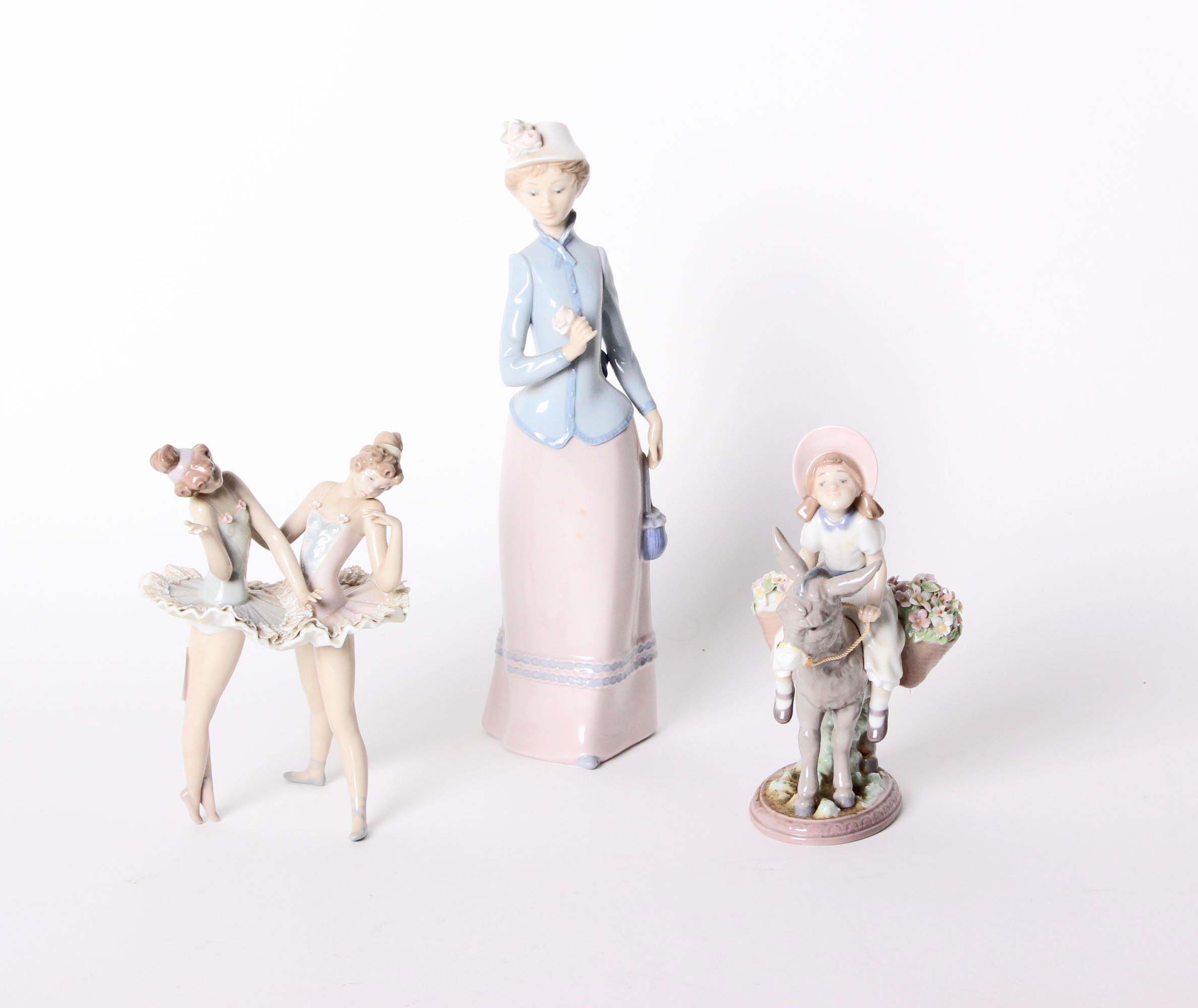 A Lladro pair of ballerinas 'Conversando Dress Rehersal' no 5497 a Lladro figure of a lady with a