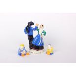 A Quimper pottery couple dancing (h: 35cm), signed by R Micheau Vernez and marked > to base,