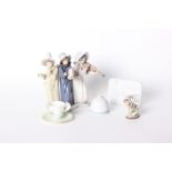 A Lladro figural group of three musicians, a Lladro bunny with roses no. 1506, a Lladro Collectors