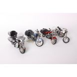 Four Franklin Mint Harley-Davidson 1:10 scale diecast model motorcycles: Electraglide, Heritage