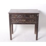 An Indian hardwood carved side table with two long drawers 76cm wide