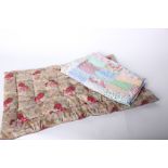 An early 20th Century cotton patchwork quilt top, and an early 20th Century floral child's quilt