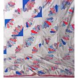 An early 20th Century American fan design patchwork quilt top, made up of pretty floral cotton