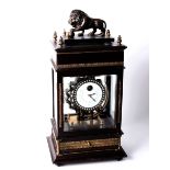 An early 20th Century German Congreve style torsion clock with mahogany and brass mounted glazed