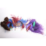 A collection of early to mid 20th Century millinery feathers, many with Paris, made in France