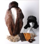 A 1950s fur stole; two pairs of fur lined leather gloves, a Russian fur hat and a quantity of