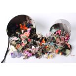 A collection of early to mid 20th Century French and English millinery flowers, including singles