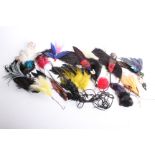 A collection of early 20th Century millinery feathers, many with their original Paris, made in