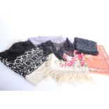 A length of 19th Century black lace; an early 20th Century rose patterned fringed wool shawl, a