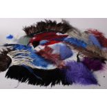 A quantity of early to late 20th Century millinery feathers, including black and white ostrich