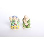 A pair of Oriental pottery money boxes