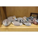 Ten hand painted wooden decoy ducks (largest 35cm long) by J Brennan, and a turned wooden bowl and