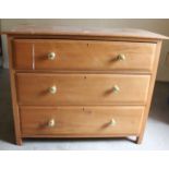 A pine chest with three drawers 98cm wide