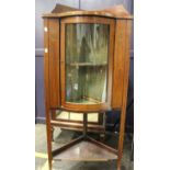 An Edwardian mahogany and inlaid corner display cabinet 132cm high, 62cm wide