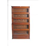 An oak Globe Wernicke five section bookcase with a drawer to base