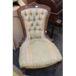 A Victorian walnut framed button back nursing chair