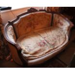 A Louis XV style carved walnut canape with a carved frame and needlework upholstery 120cm length