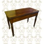 A William the IV Mahogany turn over top tea table, standing on reeded legs