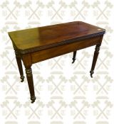 A William the IV Mahogany turn over top tea table, standing on reeded legs