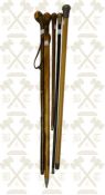 Unmarked silver gilt ebonised dress cane, oriental silver topped Malacca cane plus 3 other walking s