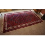 Oriental rug, red and blue with touches of white 120 inches by 78 inches