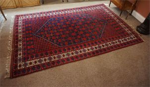 Oriental rug, red and blue with touches of white 120 inches by 78 inches