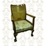 An Edwardian mahogany inlaid ladies nursing chair, an oak arts and crafts chair and a walnut occasio