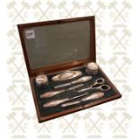 8 Piece silver mounted manicure set in a mahogany inlaid case Birmingham 1912