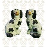 A pair of black and white Staffordshire Wally Dogs - 10 inches high