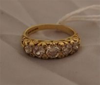 5 Graduated diamond ring set in yellow gold