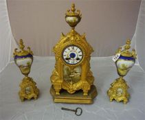 Late 19th century French porcelain and gilt metal clock garniture.